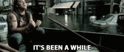 Man Rowing Boat Through Flooded City GIF