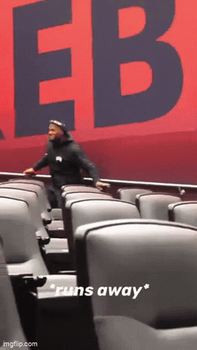 Man Running Away From Red Sign Saying EB GIF