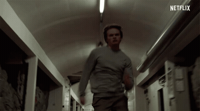 Man Running Down Hallway With Netflix Logo GIF