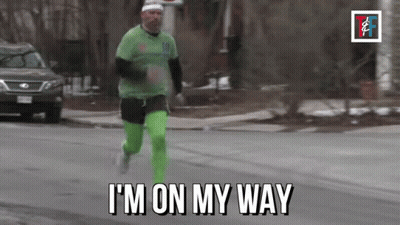 Man Running Down Street Saying Im On My Way GIF