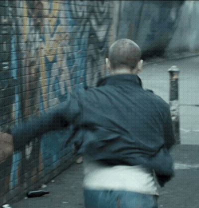 Man Running In Front Of Graffiti Wall GIF