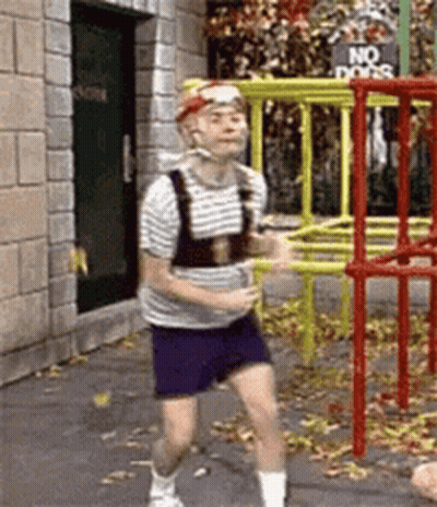 Man Running In Front Of Playground Sign Saying No Dogs GIF