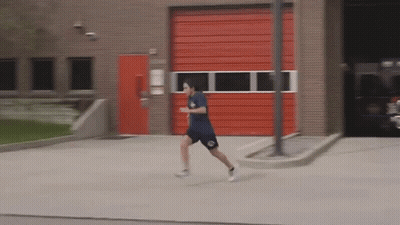 Man Running In Front Of Red Door GIF