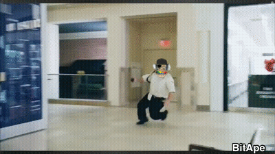Man Running In Hallway With Exit Sign GIF