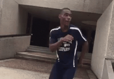 Man Running In Leopard Shirt GIF