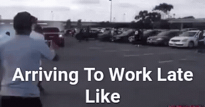 Man Running In Parking Lot Saying Arriving To Work Late GIF
