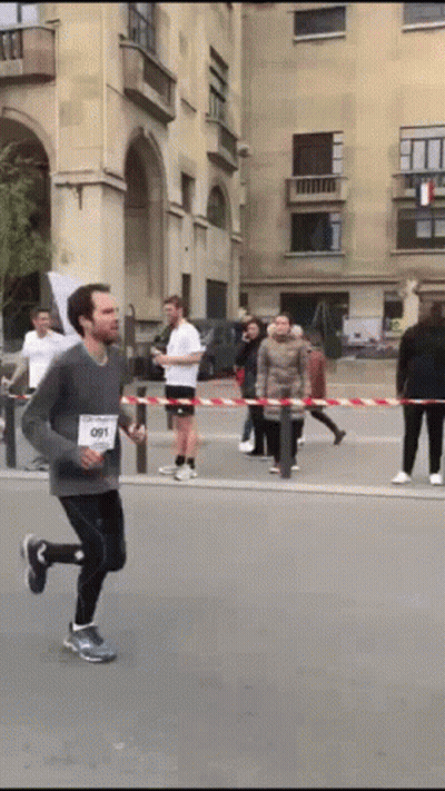 Man Running In Race With 091 On Shirt GIF