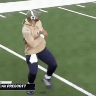 Man Running On Football Field With Headphones And Helmet GIF