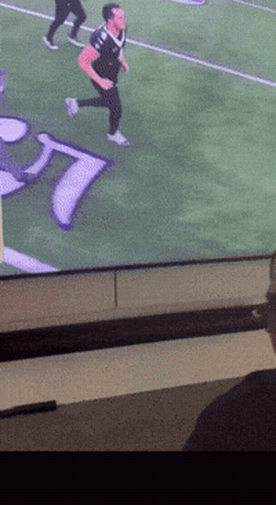 Man Running On Football Field With Letter T GIF