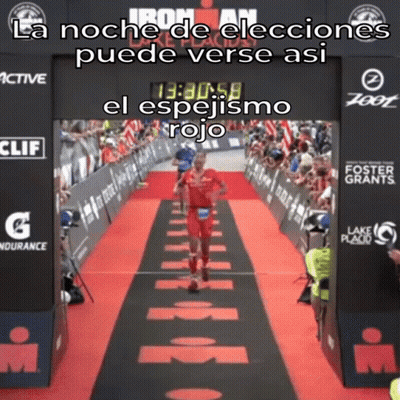 Man Running On Red Carpet In Front Of Ironman Sign GIF