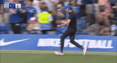 Man Running On Soccer Field Near Nike Football Ad GIF