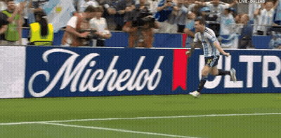 Man Running On Soccer Field With Michelob Ultra Banner GIF