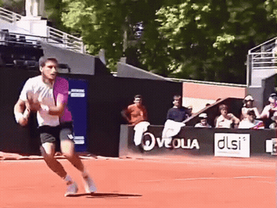 Man Running On Tennis Court With DLSI Sign GIF