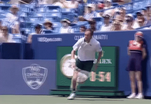 Man Running On Tennis Court With Scoreboard 1:54 GIF