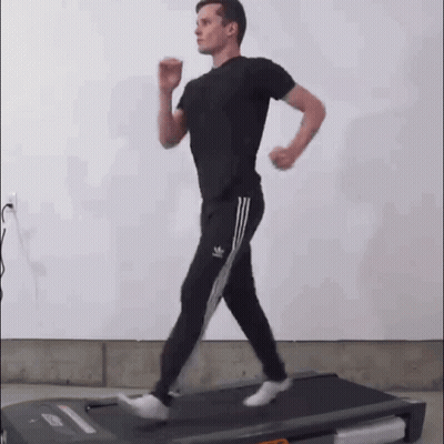 Man Running On Treadmill In Gym GIF