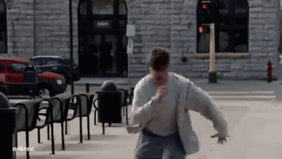Man Running Past Brick Building 1284 GIF