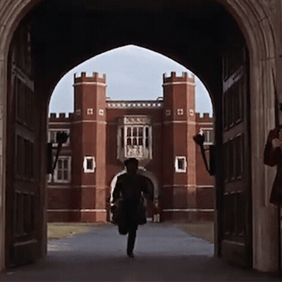 Man Running Through Archway At Brick Building GIF