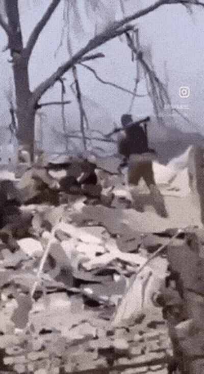 Man Running Through Rubble With Rifle GIF