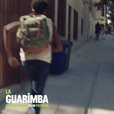 Man Running With Backpack At La Guarimba Film Festival GIF
