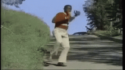 Man Running With Boxing Gloves And Red Shirt GIF