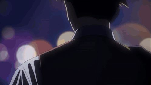 Man's Back In Dark Room With Lights GIF