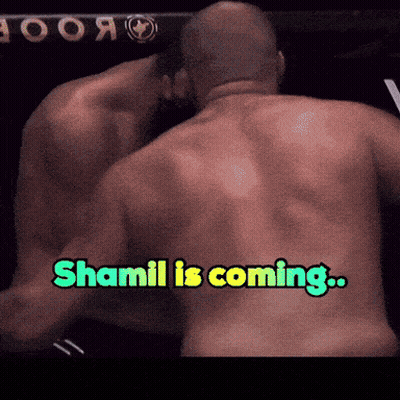 Man's Back With Words Shamil Is Coming GIF