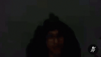 Man's Eye With Glasses In Dark GIF
