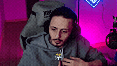 Man's Face Against Black Backdrop GIF