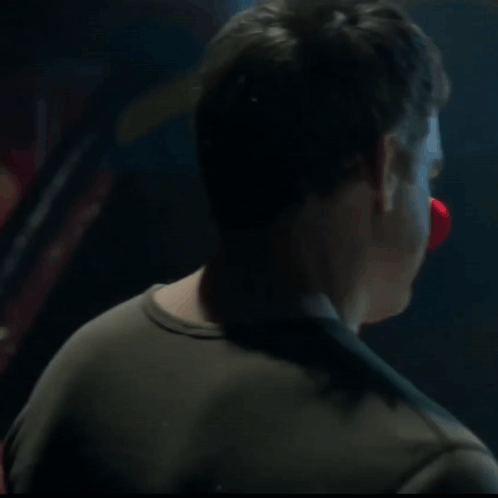 Man's Face Close Up In Dark Room GIF
