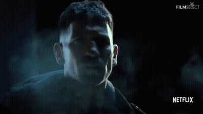 Man's Face Close Up In Dark Room GIF