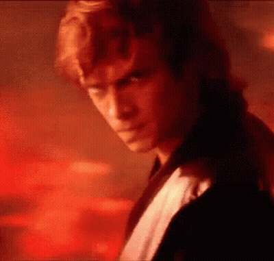 Man's Face Close Up In Dark Room GIF