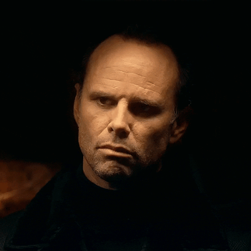 Man's Face Close Up In Dark Room GIF