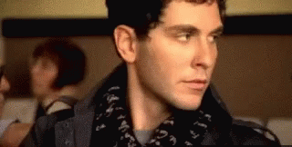 Man's Face Close Up Wearing Scarf GIF