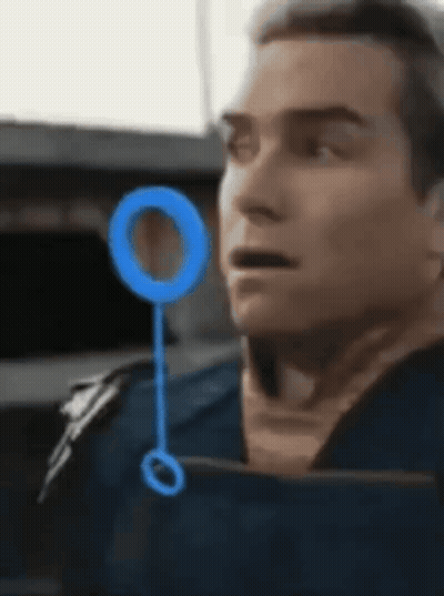 Man's Face Close Up With Blue Circle GIF