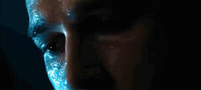 Man's Face Close Up With Blue Paint GIF