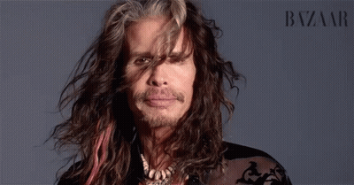 Man's Face Close Up With Harper's Bazaar GIF