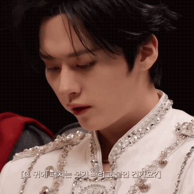 Man's Face Close Up With Korean Writing GIF