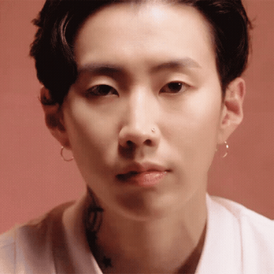 Man's Face Close Up With Nose Ring And Hoop Earrings GIF