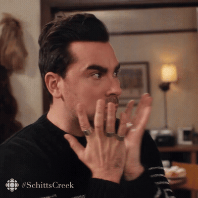 Man's Face Close Up With Schitts Creek Hashtag GIF