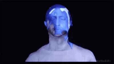 Man's Face Covered In Blue Liquid GIF