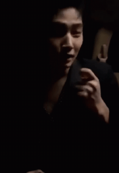 Man's Face Hand On Chest Dark Room GIF