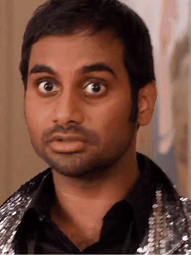 Man's Face In Black Shirt And Silver Jacket GIF