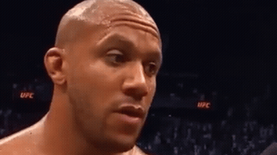Man's Face In Boxing Ring With Crowd GIF
