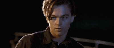 Man's Face In Dark Room Mouth Open GIF