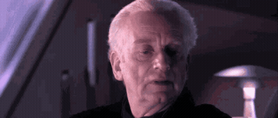 Man's Face In Dark Room With Lamp GIF