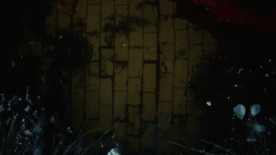 Man's Face In Dark Room With Red Lights GIF