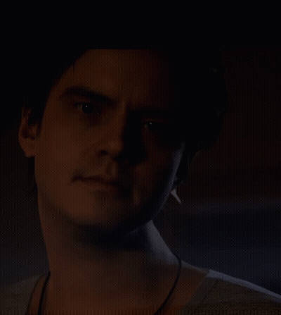 Man's Face In Dark Room GIF
