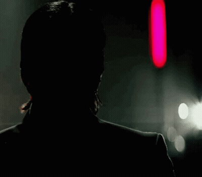Man's Face In Dark With Red Light GIF