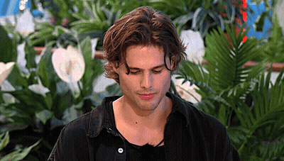 Man's Face In Front Of Plants GIF