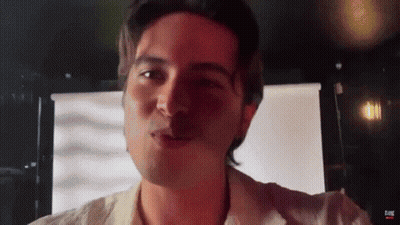 Man's Face In Front Of Screen Saying Eone GIF